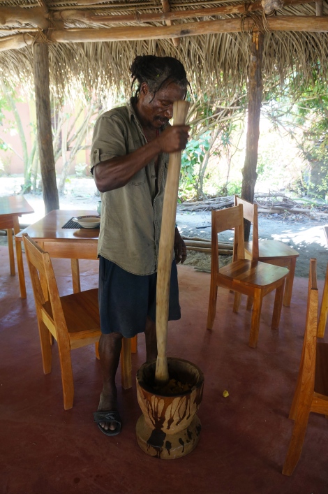 Ivan has carved his own mortar and pestle just for mashing plantains.